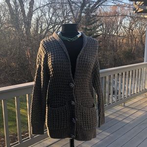 Mods boyfriend sweater with big buttons.